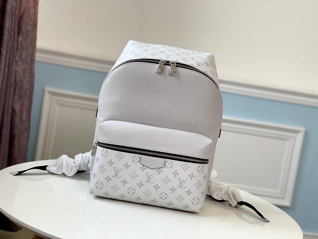 Louis vuitton original taiga leather discovery backpack M30232 white
